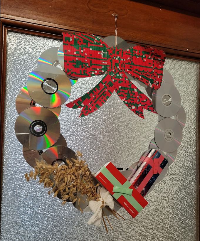 A holiday wreath made of lab supplies and oats